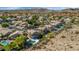 Sweeping aerial shot showcasing a community with luxurious homes, lush landscaping, and private backyard pools at 15020 S 25Th St, Phoenix, AZ 85048