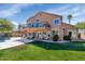 Expansive backyard featuring a covered patio, balcony, and lush green lawn perfect for outdoor living at 15020 S 25Th St, Phoenix, AZ 85048