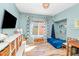 bedroom featuring a hanging swing, built in book shelves, and a large window bringing in natural light at 15020 S 25Th St, Phoenix, AZ 85048