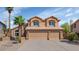 Inviting two-story home with a three-car garage, neutral palette, and manicured landscaping at 15020 S 25Th St, Phoenix, AZ 85048