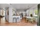 Bright open kitchen features white cabinetry, granite counters, stainless appliances, and adjacent dining area with natural light at 15020 S 25Th St, Phoenix, AZ 85048