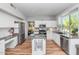 Modern kitchen with stainless steel appliances, granite countertops, and large window offering bright natural light at 15020 S 25Th St, Phoenix, AZ 85048