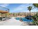 Relaxing pool area with a rock waterfall, desert landscaping, and a covered patio for shade and comfort at 15020 S 25Th St, Phoenix, AZ 85048