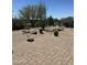 Serene backyard featuring desert landscaping, a brick patio and wrought iron fence at 15107 E Desert Willow Dr, Fountain Hills, AZ 85268