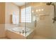 Luxurious bathroom featuring a deep soaking tub and a modern glass shower enclosure at 15107 E Desert Willow Dr, Fountain Hills, AZ 85268