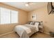 Comfortable bedroom with a cozy bed, ample natural light, and stylish decor at 15107 E Desert Willow Dr, Fountain Hills, AZ 85268