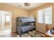 Bedroom featuring bunk beds, a ceiling fan, natural light and a desk for studying or gaming at 15107 E Desert Willow Dr, Fountain Hills, AZ 85268