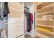 Organized walk-in closet with built-in shelves and drawers for efficient storage at 15107 E Desert Willow Dr, Fountain Hills, AZ 85268