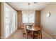 Comfortable dining area with modern light and shutters leading to the outdoor space at 15107 E Desert Willow Dr, Fountain Hills, AZ 85268