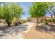 Charming single-story home with mature trees, desert landscaping, and a spacious driveway at 15107 E Desert Willow Dr, Fountain Hills, AZ 85268