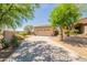 Charming single-story home with mature trees, desert landscaping, and a spacious driveway at 15107 E Desert Willow Dr, Fountain Hills, AZ 85268