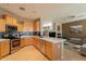 Open kitchen featuring modern appliances and a breakfast bar overlooking the living area at 15107 E Desert Willow Dr, Fountain Hills, AZ 85268