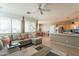 Inviting living room with tile floors, a fireplace, and comfortable sectional sofa at 15107 E Desert Willow Dr, Fountain Hills, AZ 85268