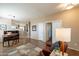Bright living room featuring wood floors, a neutral rug, and views into other living spaces at 15107 E Desert Willow Dr, Fountain Hills, AZ 85268