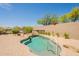 Private backyard pool with a waterfall feature and surrounding desert landscape at 15107 E Desert Willow Dr, Fountain Hills, AZ 85268