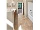 Bathroom featuring double sinks, tile flooring, and combination shower and tub at 15369 W Wethersfield Rd, Surprise, AZ 85379