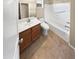 Standard bathroom with a single sink vanity, framed mirror and a shower-tub combo at 15369 W Wethersfield Rd, Surprise, AZ 85379