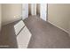 Cozy bedroom with soft carpeting and ample natural light at 15369 W Wethersfield Rd, Surprise, AZ 85379
