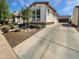 Charming single-Gathering home featuring a two-car garage and well-manicured landscaping at 15369 W Wethersfield Rd, Surprise, AZ 85379