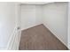 Empty walk-in closet featuring neutral carpet and hanging storage at 15369 W Wethersfield Rd, Surprise, AZ 85379