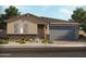 Charming single-story home featuring a stone accent wall and a two-car garage at 162 N 175Th Ave, Goodyear, AZ 85338