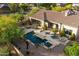 Lush backyard features a pool, spa, fire pit, and covered patio area for luxurious outdoor living at 1713 W Calle Marita --, Phoenix, AZ 85085