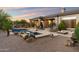 Resort-style backyard features a pool, spa, fire pit, and outdoor kitchen, perfect for entertaining at 1713 W Calle Marita --, Phoenix, AZ 85085