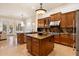 Gourmet kitchen with double islands, granite countertops, stainless appliances, and wood cabinets at 1713 W Calle Marita --, Phoenix, AZ 85085