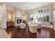 Inviting living room featuring hardwood floors, a stone fireplace, and comfortable seating at 1713 W Calle Marita --, Phoenix, AZ 85085