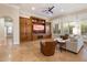 Spacious living room featuring custom built-ins, neutral tones, and plantation shutters for ample natural light at 1713 W Calle Marita --, Phoenix, AZ 85085