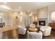 Inviting living room with fireplace, neutral tones, hardwood floors, and a cozy seating arrangement at 1713 W Calle Marita --, Phoenix, AZ 85085