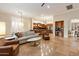 Open-concept living room flowing into kitchen with an island and a seamless transition to the dining area at 1713 W Calle Marita --, Phoenix, AZ 85085