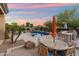 Outdoor swimming pool with desert landscaping, poolside dining and lounge area, BBQ and bar, and beautiful mountain views at 1713 W Calle Marita --, Phoenix, AZ 85085