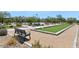 Park area with bocce ball court, picnic tables, seating and basketball hoop at 1713 W Calle Marita --, Phoenix, AZ 85085