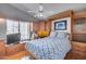 Bedroom featuring a Murphy bed and built-in desk with natural light from a bay window at 17162 N Winding Trl, Surprise, AZ 85374