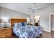 Bedroom with bed and bathroom access features and night stands and lamps at 17162 N Winding Trl, Surprise, AZ 85374