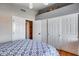 Bedroom with sliding door closet and built in shelves above, offers ample storage options at 17162 N Winding Trl, Surprise, AZ 85374