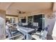 Enjoy outdoor living on this covered patio complete with a ceiling fan and outdoor seating at 17162 N Winding Trl, Surprise, AZ 85374