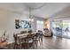 Comfortable dining room with a modern table set and sliding door to the outdoor patio at 17162 N Winding Trl, Surprise, AZ 85374