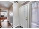Bright entryway with wood flooring, white door, and natural light from nearby windows at 17162 N Winding Trl, Surprise, AZ 85374