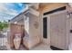 Inviting front porch with stylish accents, desert landscaping, and cozy curb appeal at 17162 N Winding Trl, Surprise, AZ 85374