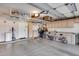 Organized garage interior with cabinetry and ceiling storage for efficient space use at 17162 N Winding Trl, Surprise, AZ 85374