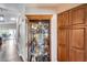 Hallway showcases a charming display case and additional wooden cabinetry for extra storage space at 17162 N Winding Trl, Surprise, AZ 85374