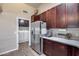 Bright kitchen with laundry access, stainless appliances, and a modern aesthetic at 17162 N Winding Trl, Surprise, AZ 85374