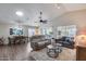 Spacious living room with vaulted ceilings and multiple seating areas for relaxation and entertainment at 17162 N Winding Trl, Surprise, AZ 85374
