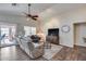 Bright living area featuring a comfortable seating arrangement and sliding door access to the patio at 17162 N Winding Trl, Surprise, AZ 85374