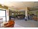 Relaxing lounge area with comfortable seating, tables, and cozy ambiance for social gatherings at 17162 N Winding Trl, Surprise, AZ 85374