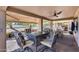 This covered patio area is perfect for entertaining guests with space for multiple outdoor seating arrangements at 17162 N Winding Trl, Surprise, AZ 85374