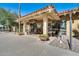 Exterior view of the Wood Shop featuring outdoor seating and a welcoming entrance at 17162 N Winding Trl, Surprise, AZ 85374