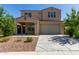Charming two-story home with a neutral color palette, well-maintained landscaping and inviting front porch at 17425 W Willow Ave, Surprise, AZ 85388